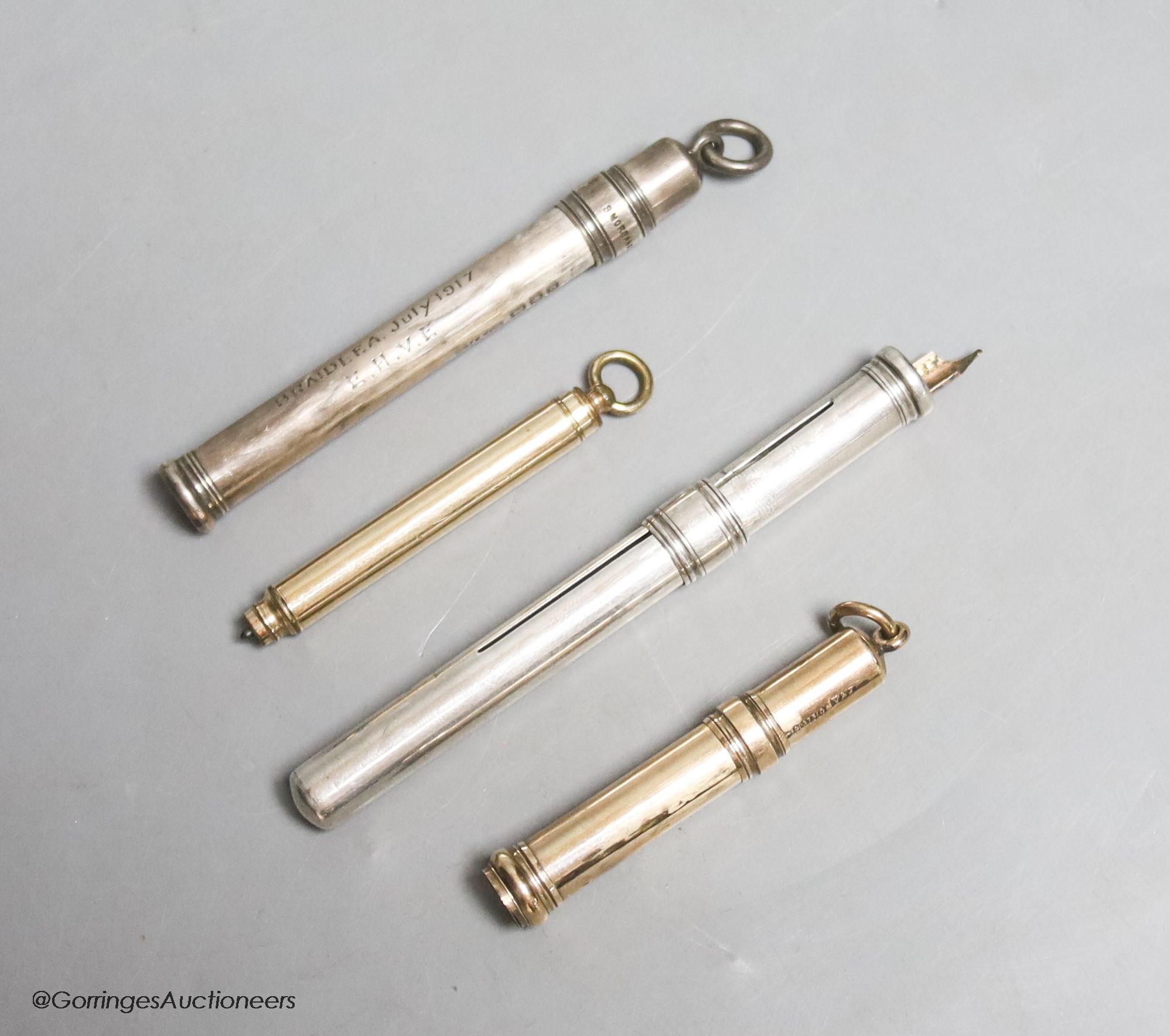 A 9ct gold propelling pencil case, gross 6.4 grams, one other similar yellow metal pencil and two white metal cased pencils, one stamped silver, the other S. Mordan & Co.